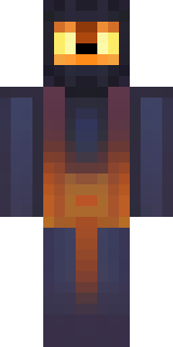 a Halloween pumpkin-headed figure in a dark cloak